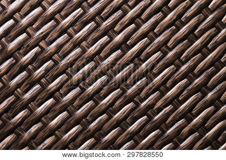 Close-up Dark Brown Background Is An Element Of Wicker Furniture Made Of Polymer Fibers. Synthetic L