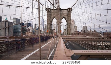 The Brooklyn Bridge At Daytime With The Camera Pointing Towards New York City. A Long Exposure With 