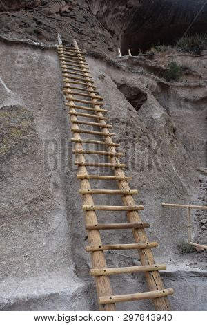Very Tall Ladder Extending Up Into The Cliff Dwellings And Caverns Of Bandelier Natioal Park.