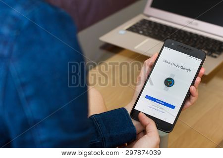 San Francisco, Us - 22 April 2019: Close Up To Female Hands Holding Smartphone Using Wear Os By Goog