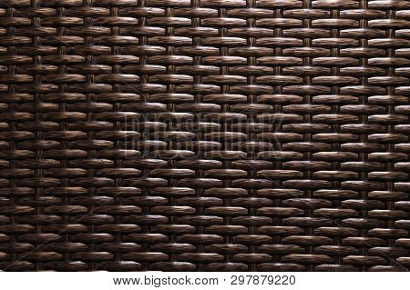 Close-up Dark Brown Background Is An Element Of Wicker Furniture Made Of Polymer Fibers. Synthetic L