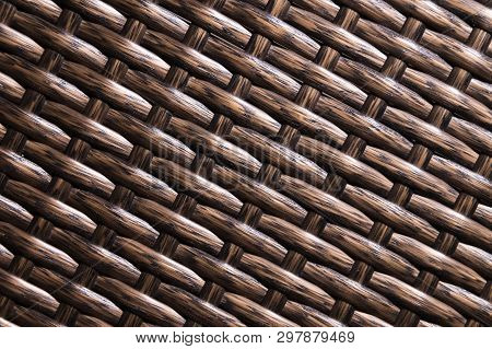 Close-up Dark Brown Background Is An Element Of Wicker Furniture Made Of Polymer Fibers. Synthetic L