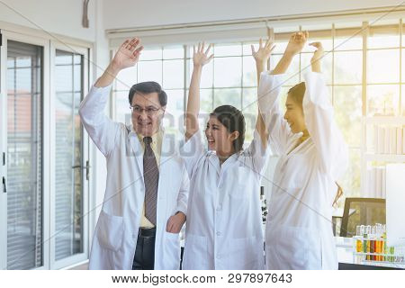 Scientists Hands Rais Up,group Of Diversity People Teamwork In Laboratory,success And Reserch Workin