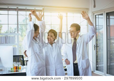 Scientists Hands Rais Up,group Of Diversity People Teamwork In Laboratory,success And Reserch Workin