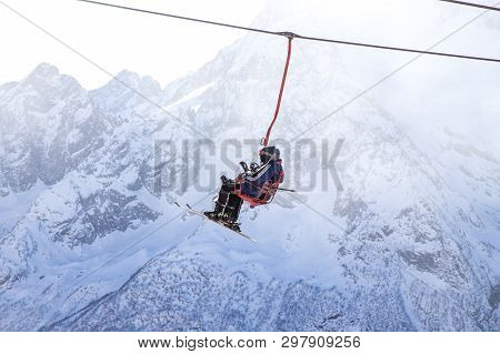Dombai, Russia - January 3, 2014: People Are Lifting On Open Lft High Up In Caucasus Mountains