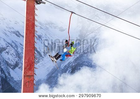 Dombai, Russia - January 3, 2014: People Are Lifting On Open Lft High Up In Caucasus Mountains