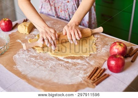Woman Kneading Dough For The Apple Pie On Kitchen Table. Rustic Style