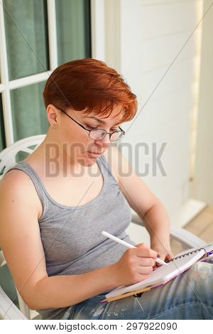 Pondering Attractive Caucasian Woman With Pen In Hand Thinking On Plans And Writing List To Do In No
