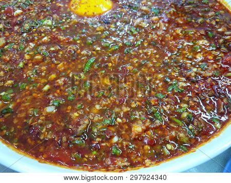 Thai Food Style, Blurred Of Spicy Seafood Dipping Sauce Sprinkled With Scallion Sliced In White Bowl