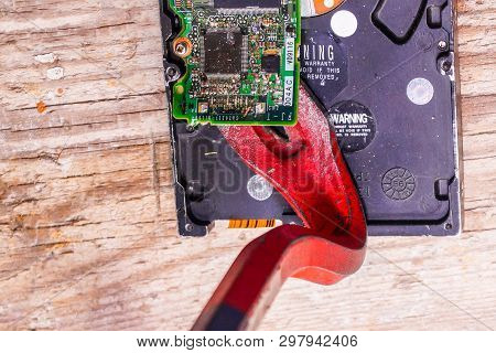 A Man Breaks A Computer Using Locksmith Tools.