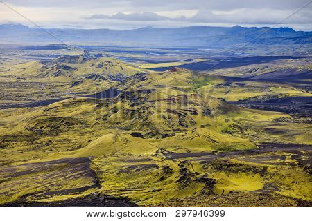 Dramatic Iceland Landscape Of Craters Of Laki Volcanic Fissure With A Green Hill And Black Lava Look