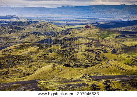 Dramatic Iceland Landscape Of Craters Of Laki Volcanic Fissure With A Green Hill And Black Lava Look