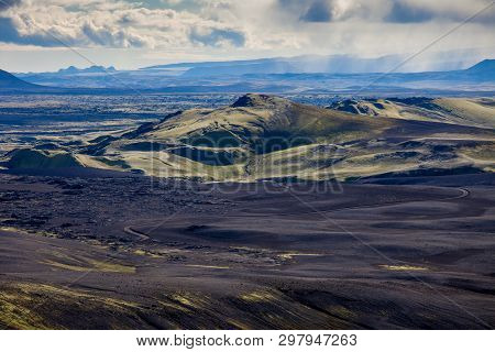 Dramatic Iceland Landscape Of Craters Of Laki Volcanic Fissure With A Green Hill And Black Lava Look