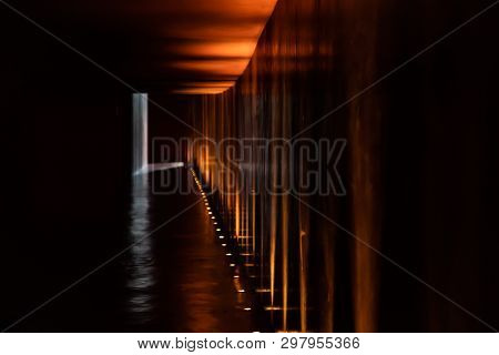 Mystery Abstract Blurry Walk Way With Tungsten Light Beside The Way.