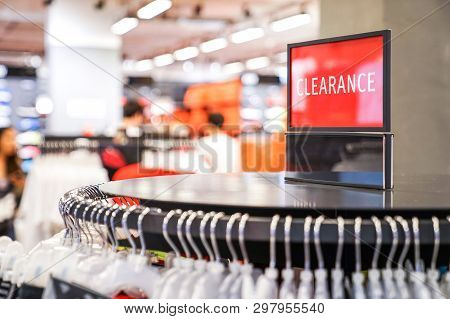 Clearance Sales Red Sing On Sportware Cloth With Blur Store Background.