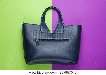 Leather Handbag On Green-purple Background. Top View
 