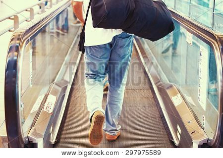 Men At Horizontal Escalator Covered. Moving Walkway, Moving Sidewalk, Moving Pavement, Autopedescala