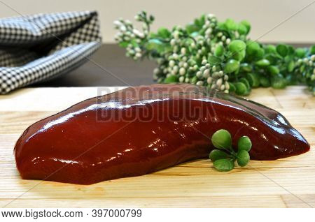 Piece Of Raw Liver A Beef Or Pork From Inside On A Wooden Board, Organ Meats For Pate Recipes And Mo