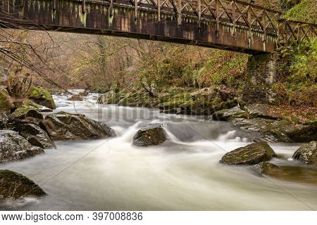 Long Exposure Of The East Lyn River Flowing Under A Bridge At Watersmeet In Exmoor National Park In 