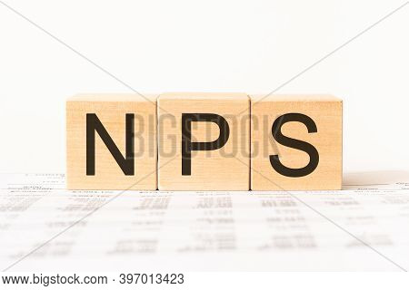 Word Nps. Wooden Small Cubes With Letters Isolated On White Background With Copy Space Available.bus