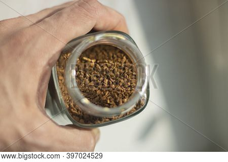 Freeze-dried Coffee In A Glass Jar. Coffee Drink. Granules Made From Coffee Beans.