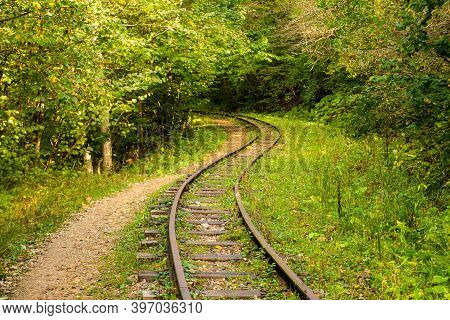 Abandoned Railway In Autumn Mountain Forest With Foliar Trees In Caucasus, Mezmay.
