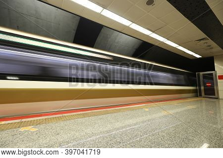 Motin Blured Metro Moving In A Station