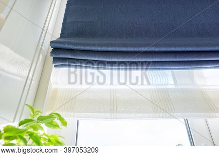 Roman Blind In The Interior Detail Close-up. Curtain Blue Blackout Fabric, Sheers White Linen, Fashi