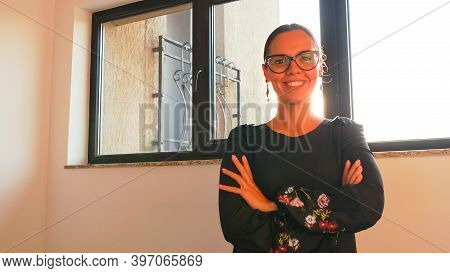 Professional Businesswoman Looking At Camera Standing On Stairs In Corporate Finance Building. Entre