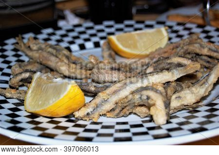 Typical Spanish Dish, Fried Fish, Served As A Tapa In A Bar In Granada (spain).