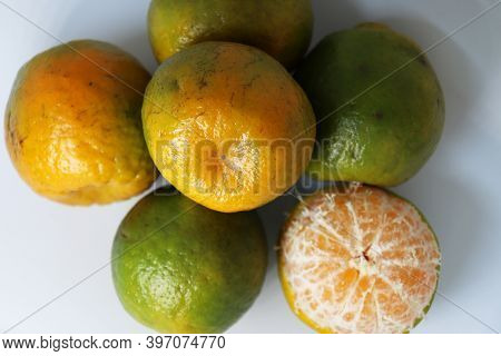 Green And Yellow Colored Orange Stock