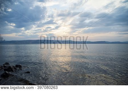 Sunset Over The Sea Of Galilee And Golan Heights. High Quality Photo.