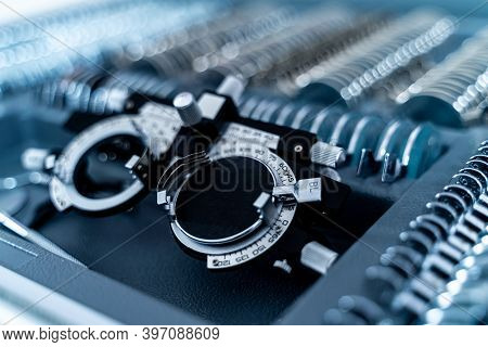 Vision Test Equipment With. Frame With Additional Lenses. Selective Focus Of Eye Glasses Equipment.