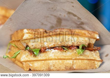 Sandwich In A Paper Bag Close-up. Sandwich Filet Americain, Close Up Of Burger. Fast, But Unhealthy 