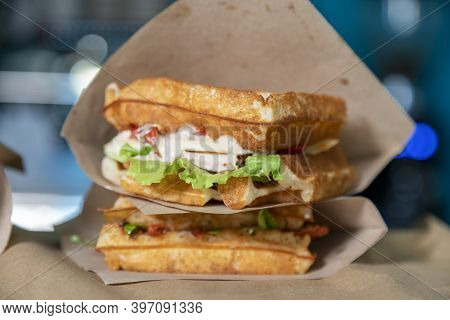 Sandwich In A Paper Bag Close-up. Sandwich Filet Americain, Close Up Of Burger. Fast, But Unhealthy 