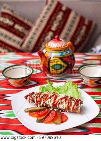 Brizol - A Dish Of Omelet And Beef Covered With Ketchup And Mayonnaise In An Oriental Style