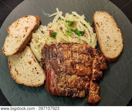 Pork Knuckle With White Cabbage And Bread