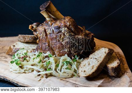 Pork Knuckle With White Cabbage And Bread