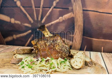 Pork Knuckle With White Cabbage And Bread