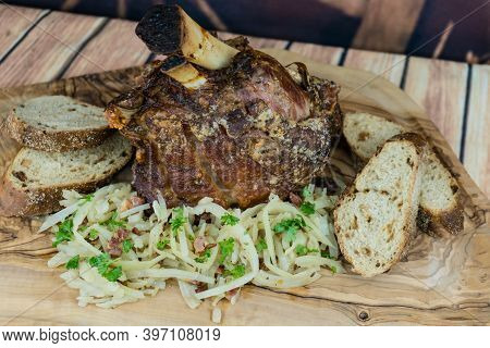 Pork Knuckle With White Cabbage And Bread