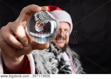 Cheerful Santa Dressed In Fur Skin With Crystal Spehre