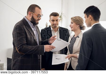 The Chief Of The Construction Company Holds A Standing Meeting With Subordinates, Gives Instructions