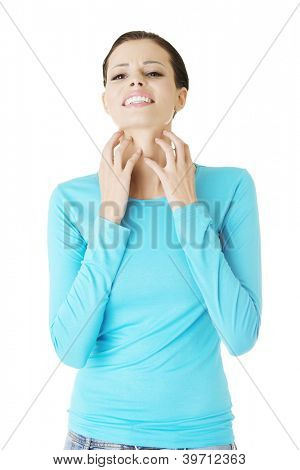 Young beautiful woman scratching her self. Isolated on white