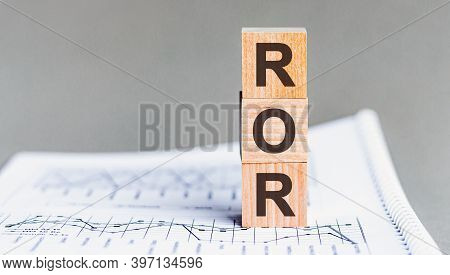 Letter Of The Alphabet Of Ror On A Grey Background. Ror - Rate Of Return
