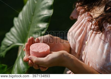 Young Woman Holding Natural Eco Friendly Solid Shampoo Bar, Conditioner Or Soap. Zero Waste And Sust