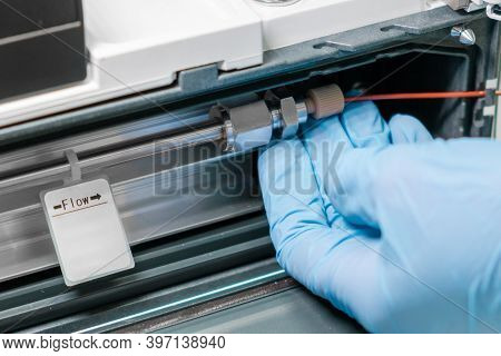 Close Up Scientist Changing A Column In Hplc System. Analytical Chemistry Laboratory. Preparation Be