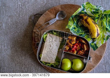 Healthy Vegan Meal Served In Eco-friendly Kitchen Tableware: Stainless Metal Food Container Or Lunch