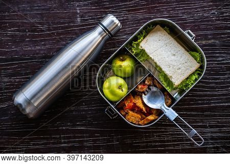 Stainless Steel Food Container Or Lunch Box With Healthy Vegetarian Meal And Reusable Thermo Bottle 