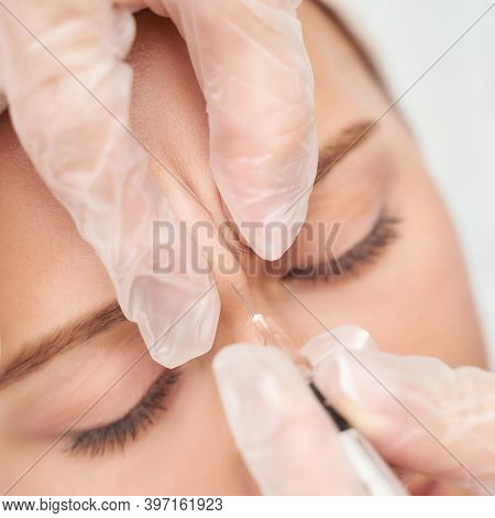 Forehead Injection At Spa Salon. Doctor Hands. Closeup. High Quality. Pretty Female Patient. Beauty 