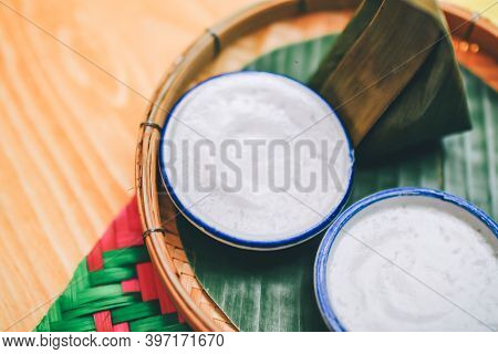 Thai Dessert Coconut Milk Pudding In Small Porcelain Cup Or Khanom Thuai And Steamed Coconut Custard